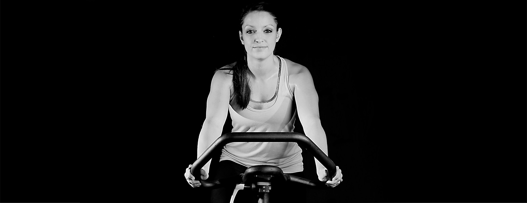 Smart Fitness member training on a stationary bike